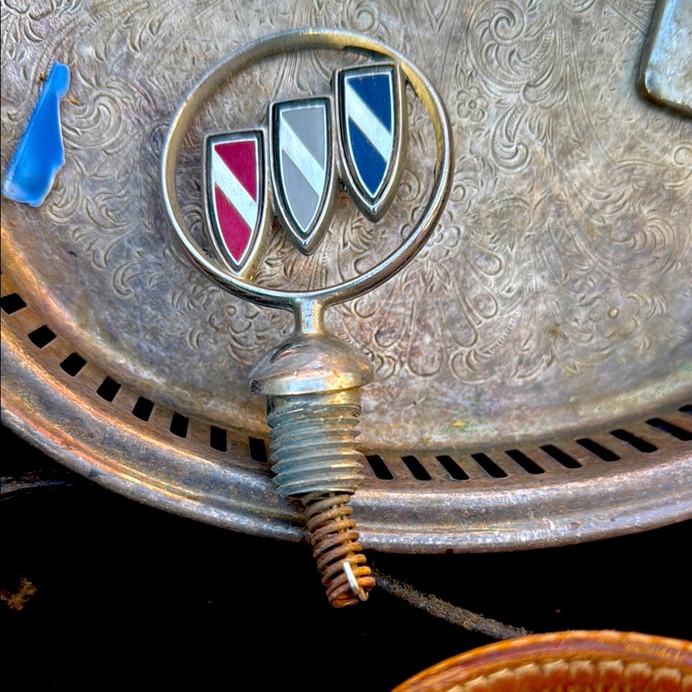 Vintage Metal Emblem with Red, White, and Blue Shields